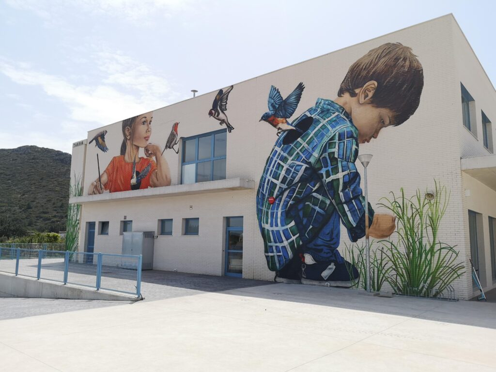 Educational mural in La Xara school - urban art for educational centers.